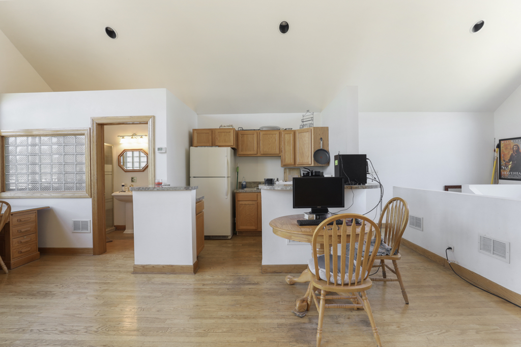 2-n584 South Ardmore Avenue Addison, IL 60101 - Photo 21 of 34 a living room with furniture a desk and chair