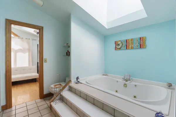 a bathroom with a tub and sink