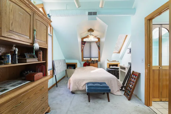 a room with table chairs and a stove
