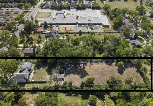 an aerial view of residential house with outdoor space