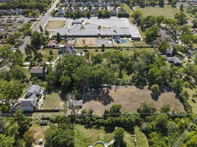 an aerial view of a house with a lake view
