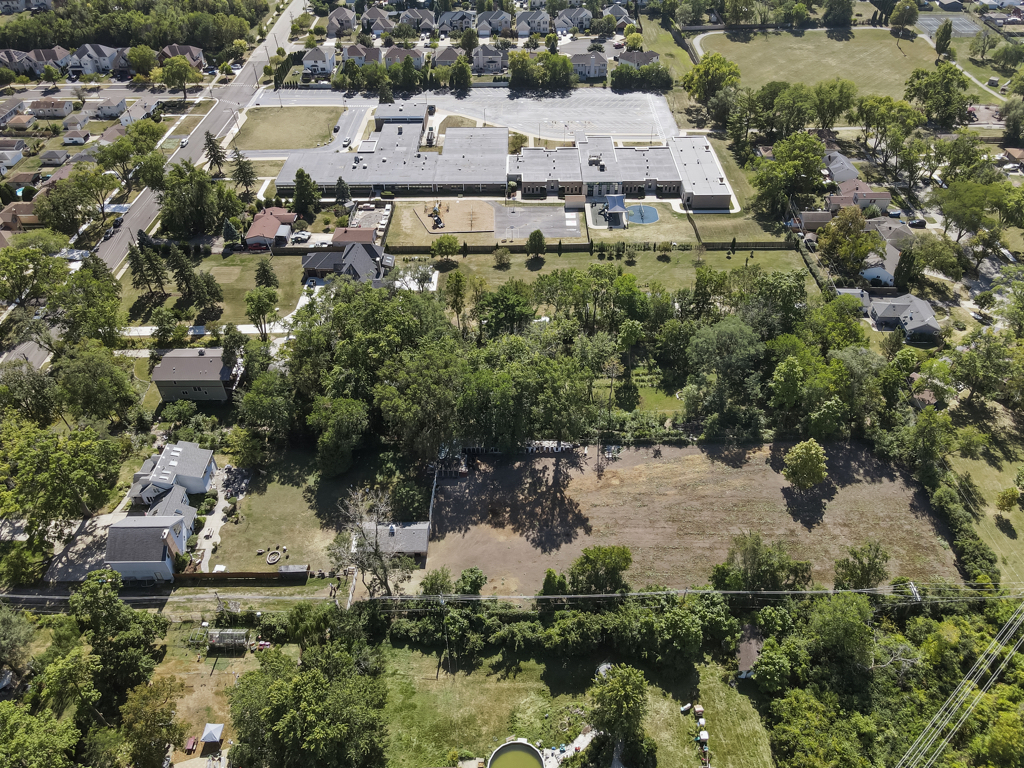 2-n584 South Ardmore Avenue Addison, IL 60101 - Photo 32 of 34 an aerial view of a house with a yard and lake view