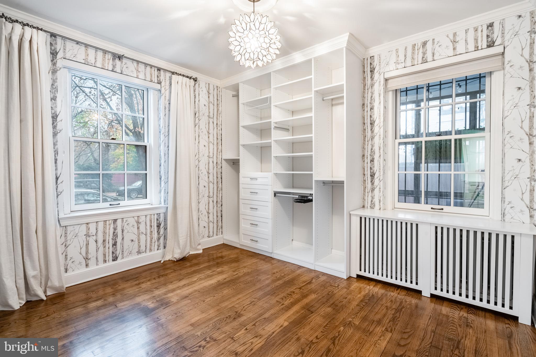 1127 C Street Southeast, Unit 1 Washington, DC 20003 - Photo 18 of 26 a view of empty room with wooden floor and windows