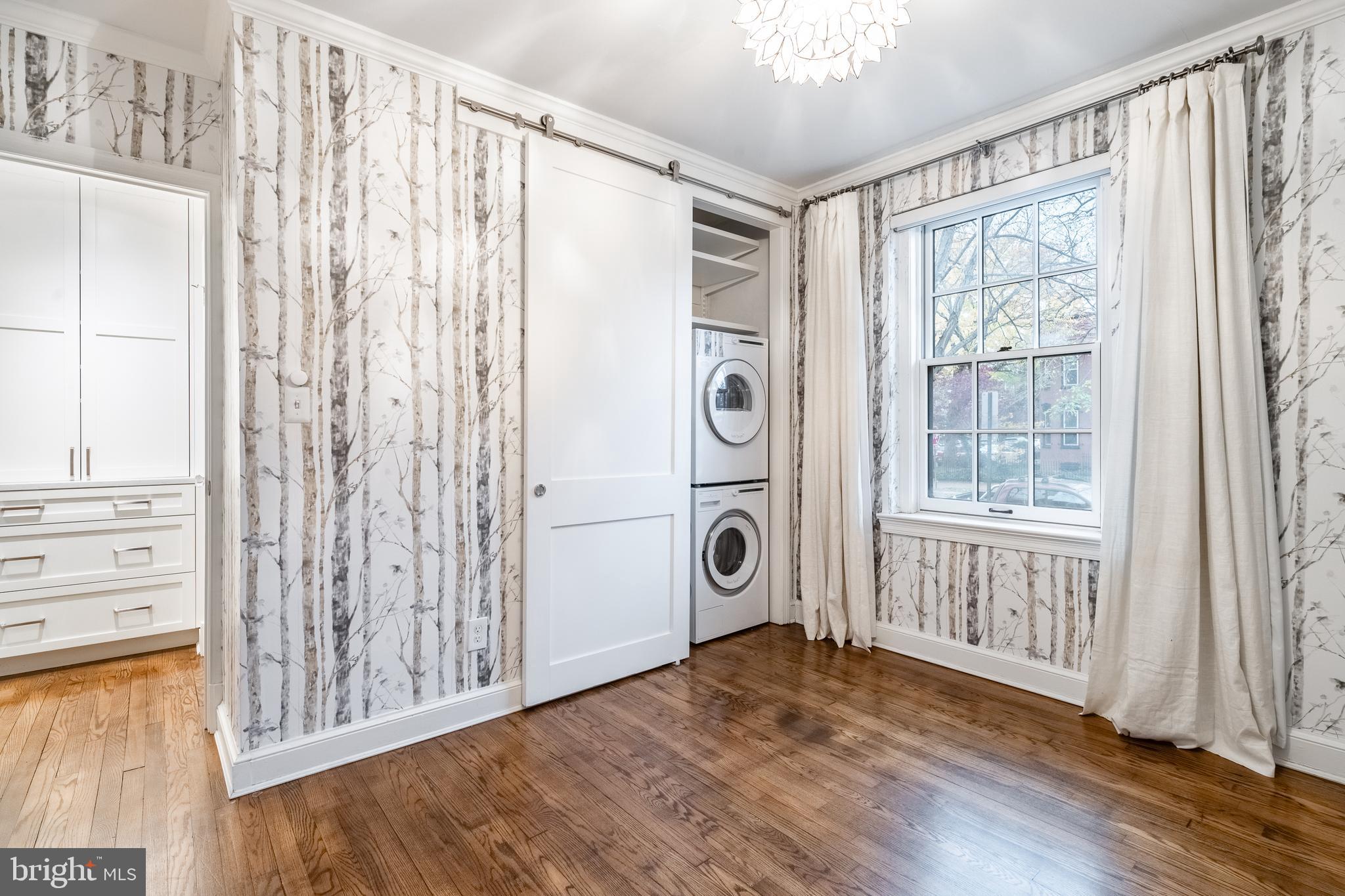 1127 C Street Southeast, Unit 1 Washington, DC 20003 - Photo 19 of 26 a view of a hallway with wooden floor and doors