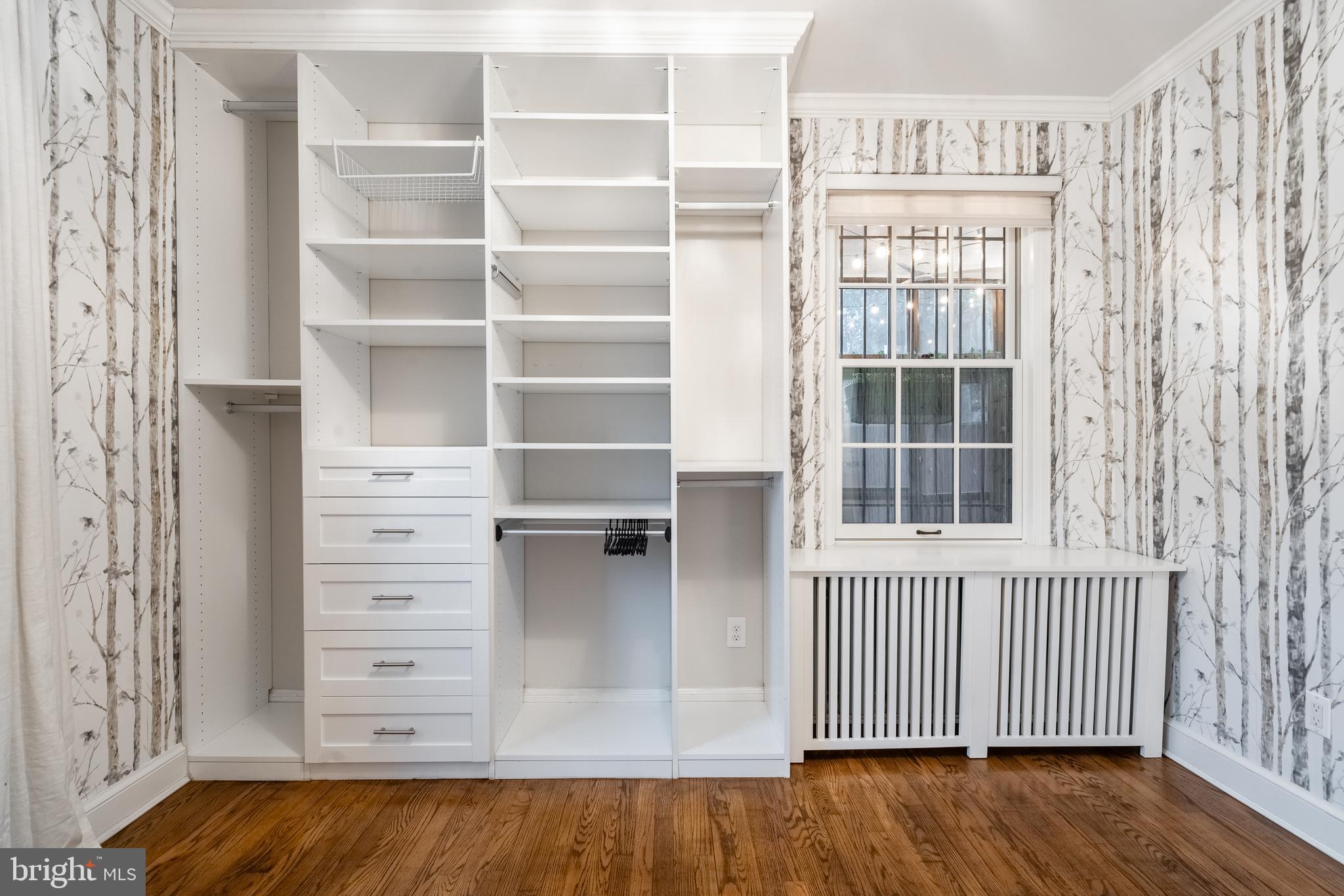 1127 C Street Southeast, Unit 1 Washington, DC 20003 - Photo 22 of 26 a view of a bedroom with furniture and wooden floor