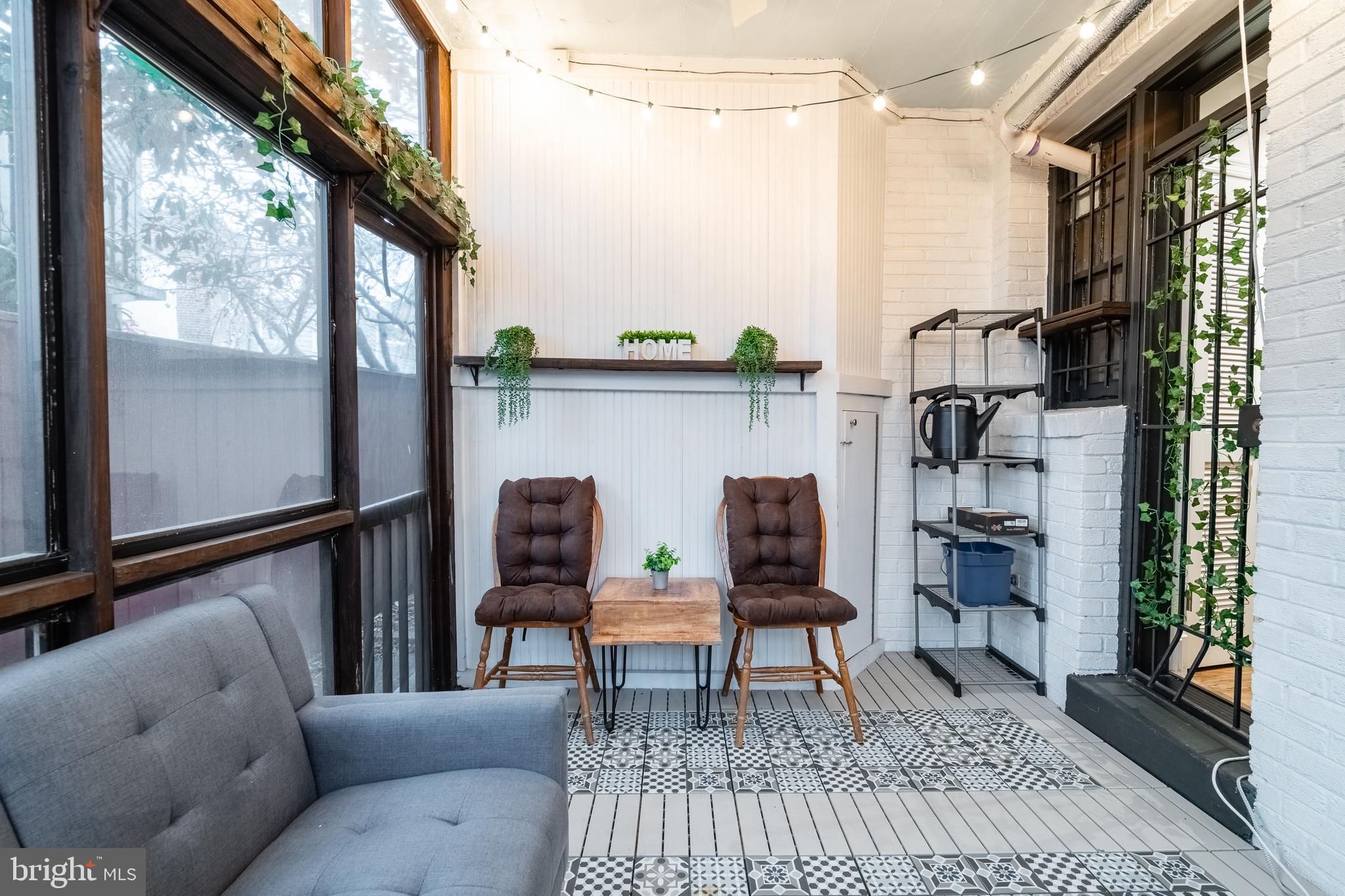 1127 C Street Southeast, Unit 1 Washington, DC 20003 - Photo 24 of 26 a living room with furniture and a window