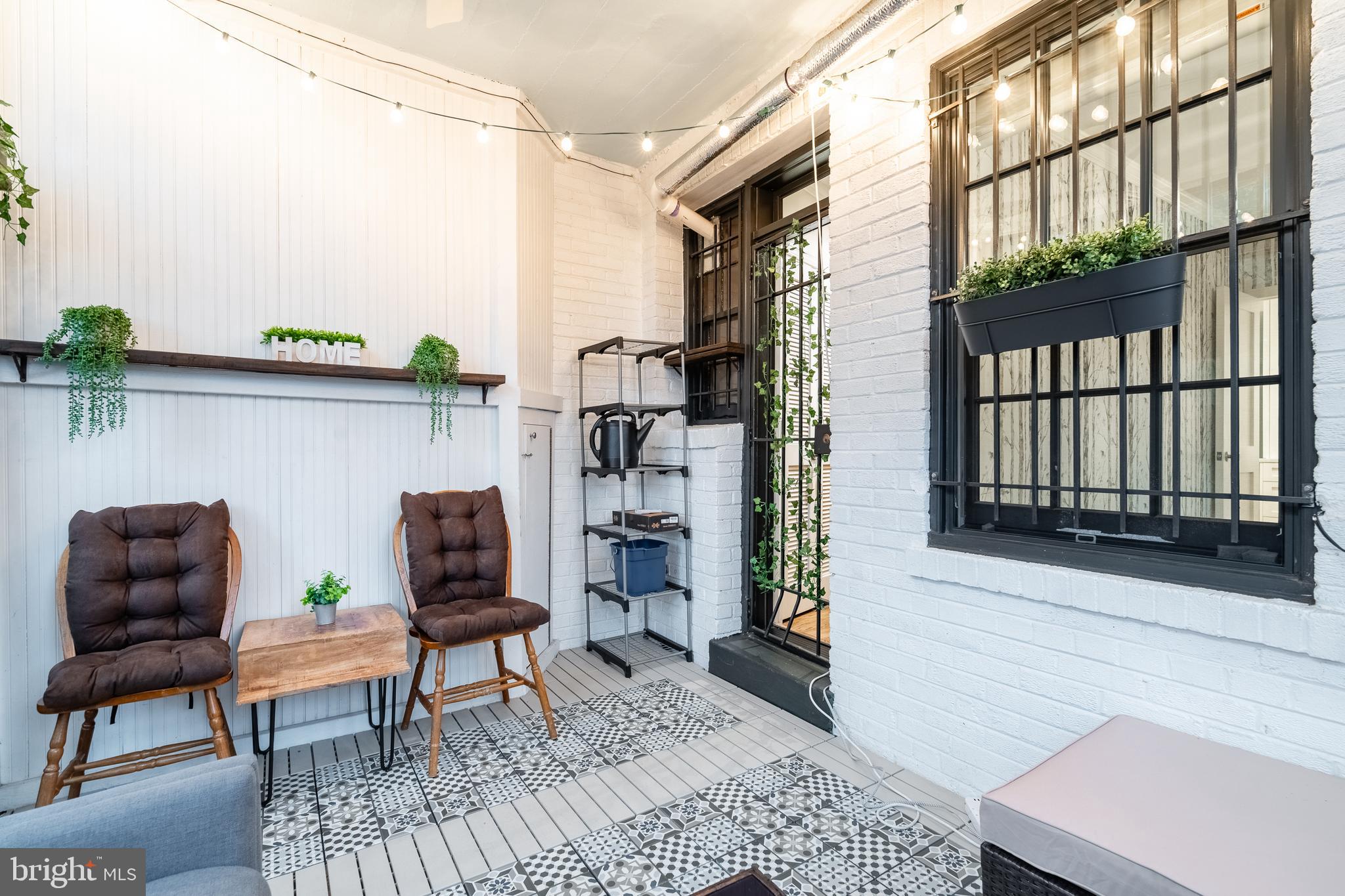 1127 C Street Southeast, Unit 1 Washington, DC 20003 - Photo 25 of 26 a living room with furniture and a window