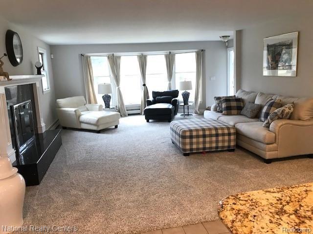 3808 Ellisia Road Commerce Township, MI 48382 - Photo 15 of 41 Huge Great Room with newer carpet and gorgeous natural fireplace