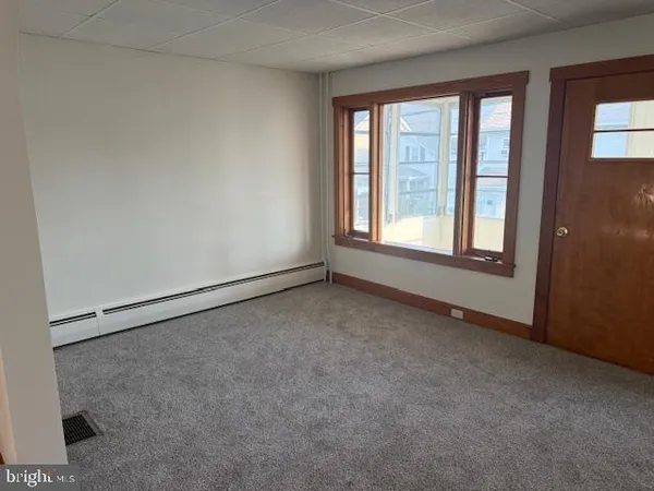 a view of an empty room with a window