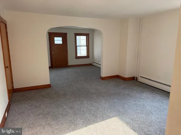 a view of empty room with windows