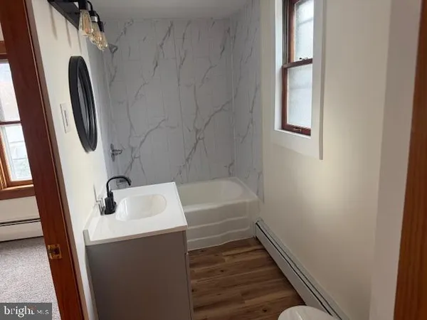 a bathroom with a sink and bathtub
