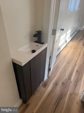 a kitchen with a sink and a refrigerator