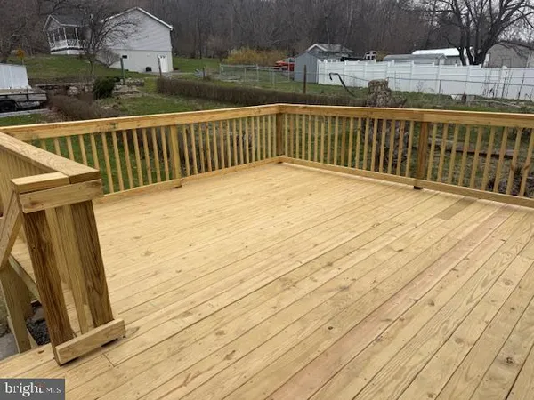 a balcony with wooden floor