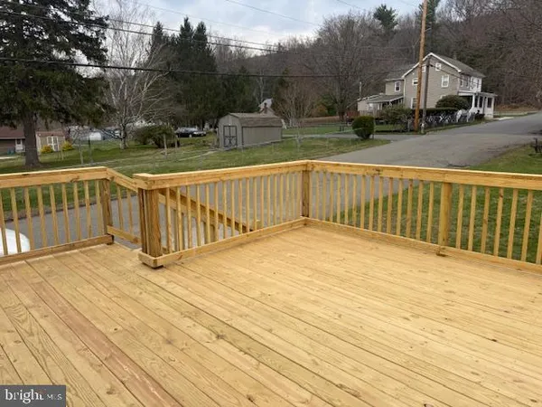 a view of street with wooden deck