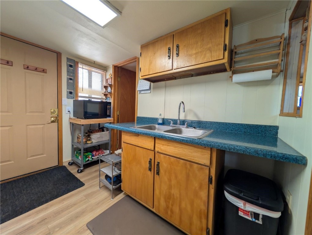 2117 Badger Creek Road Hartsel, CO 80449 - Photo 24 of 46 a kitchen with stainless steel appliances granite countertop a sink dishwasher stove and cabinets
