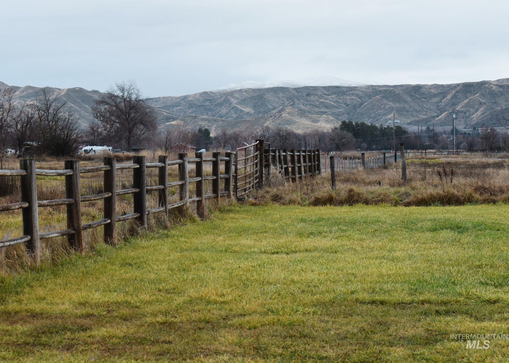 2412 South Mill Road Emmett, ID 83617 - Photo 5 of 18 View of yard featuring a mountain view and a view of countryside