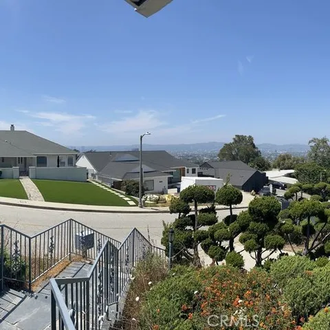 an aerial view of a house with outdoor space and street view