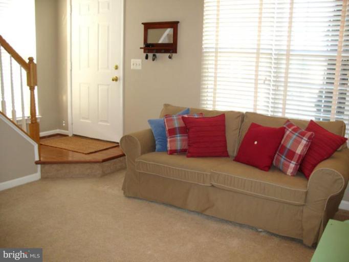 5866 Summers Grove Road Alexandria, VA 22304 - Photo 1 of 19 a living room with furniture and a window