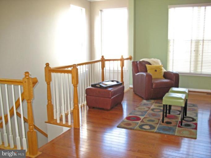 5866 Summers Grove Road Alexandria, VA 22304 - Photo 5 of 19 a living room with furniture wooden floor and a large window