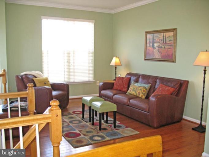 5866 Summers Grove Road Alexandria, VA 22304 - Photo 8 of 19 a living room with furniture and a window