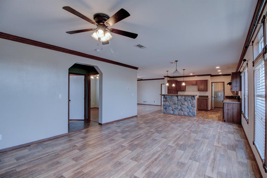7575 Honey Creek Road Celina, TX 75009 - Photo 12 of 39 Living area and kitchen open to the dinning area