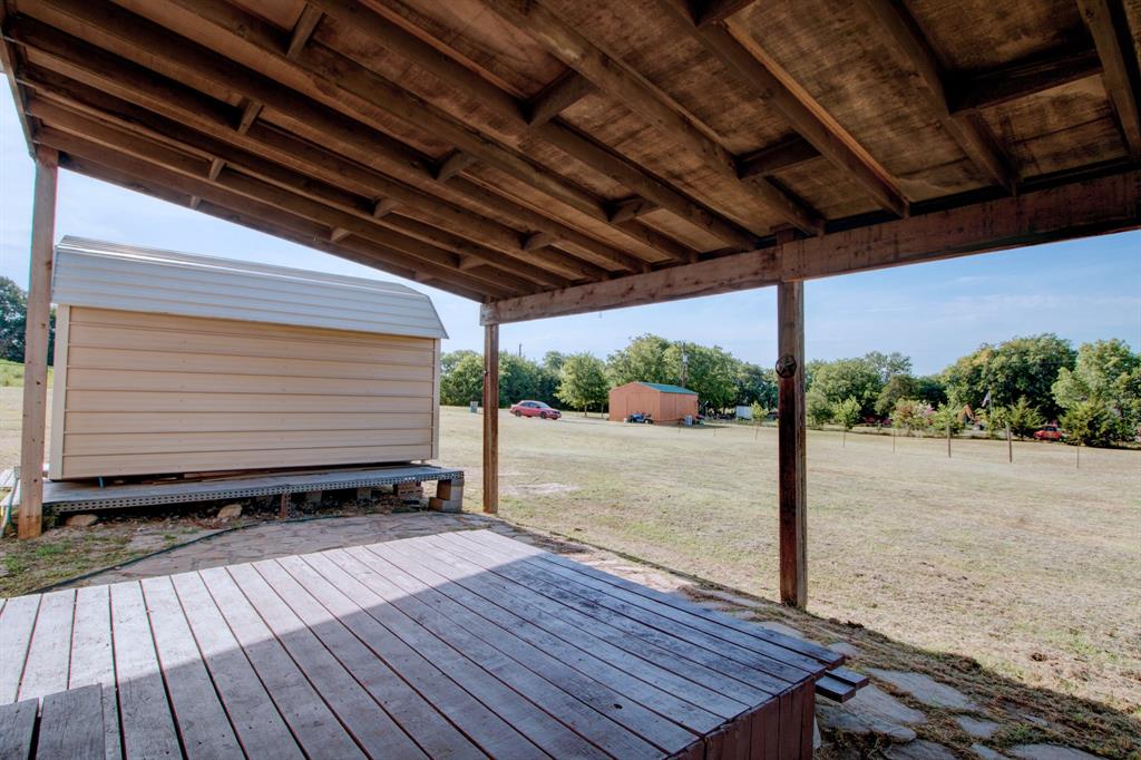 7575 Honey Creek Road Celina, TX 75009 - Photo 27 of 39 Covered deck. Great space for a summer time BBQ