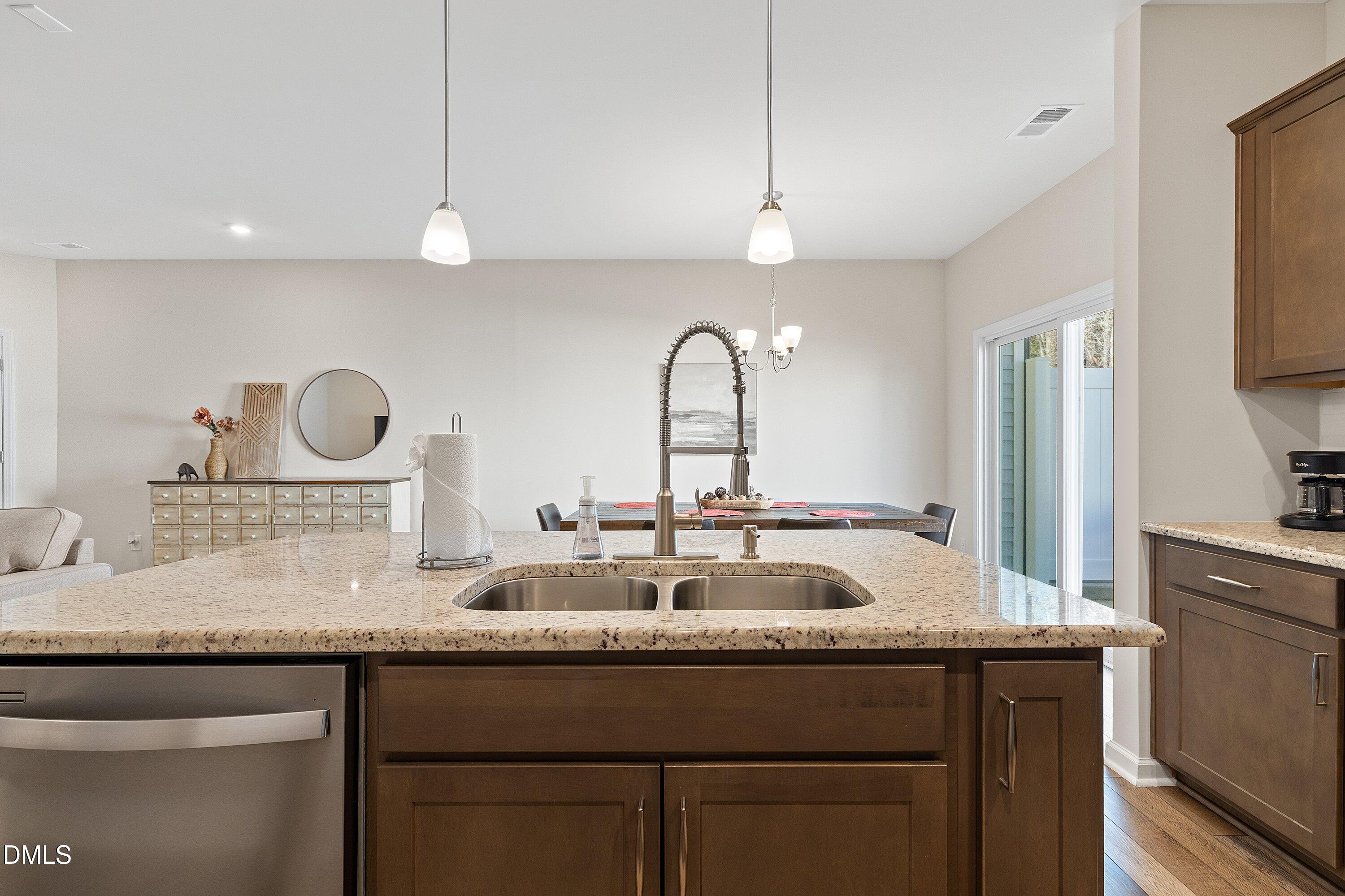 1004 Everglades Way Durham, NC 27713 - Photo 17 of 40 a kitchen with a sink and a refrigerator