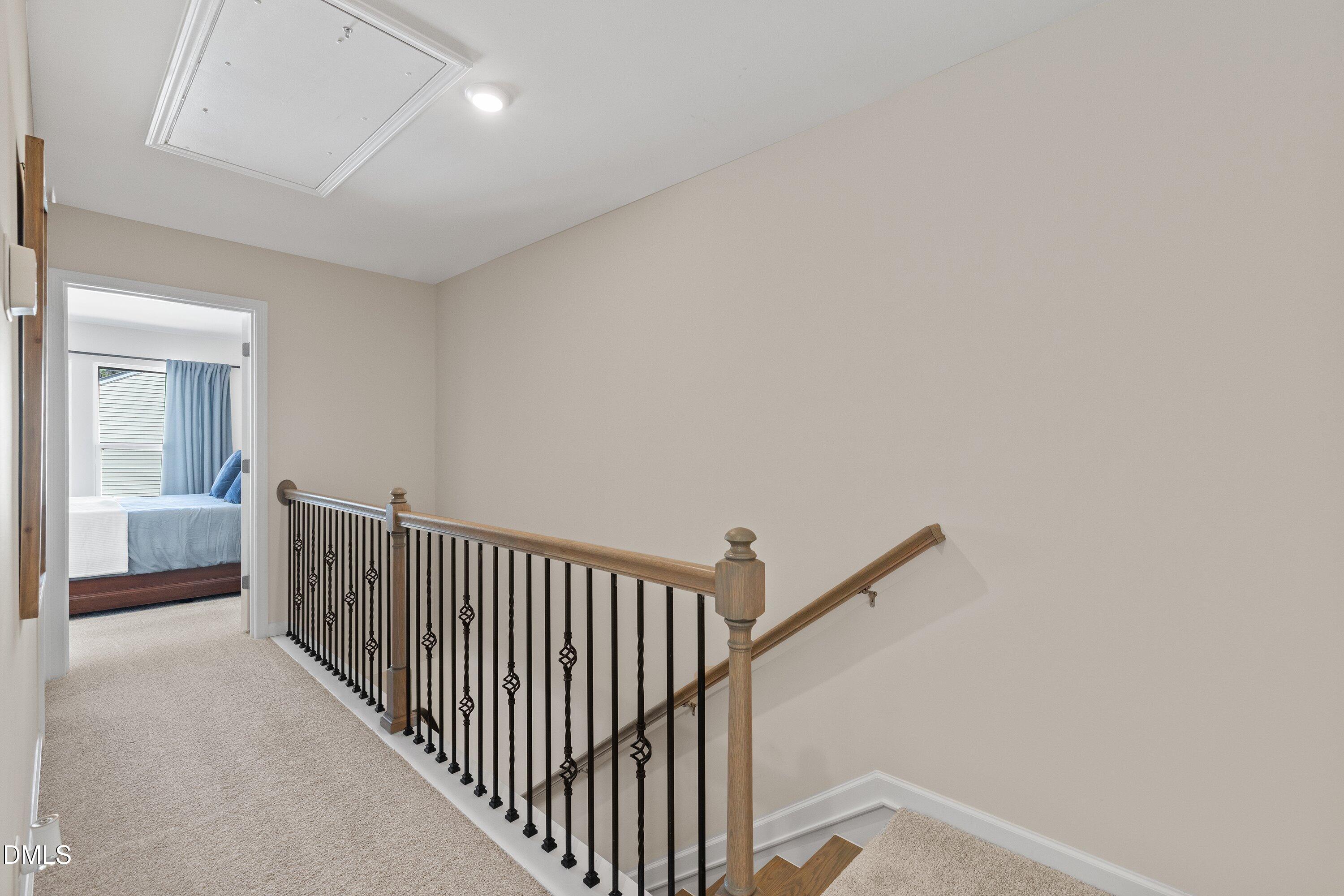 1004 Everglades Way Durham, NC 27713 - Photo 22 of 40 a view of a hallway with windows