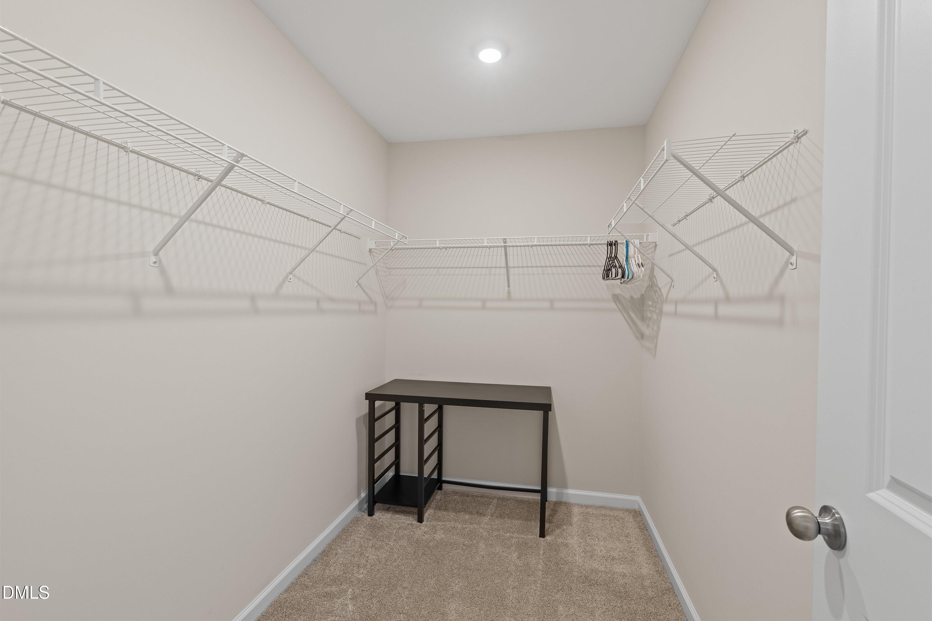 1004 Everglades Way Durham, NC 27713 - Photo 33 of 40 a view of a room with racks on the wall