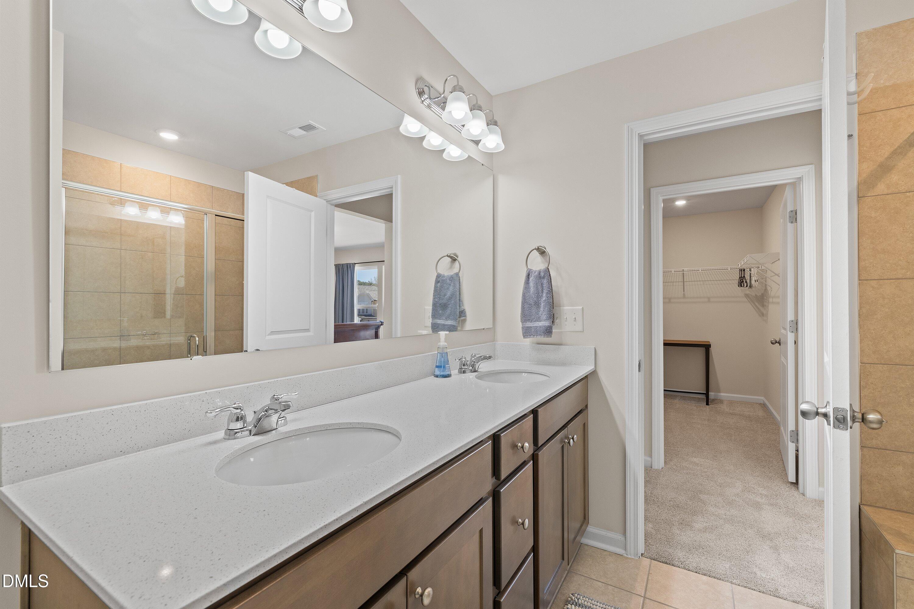 1004 Everglades Way Durham, NC 27713 - Photo 35 of 40 a bathroom with a sink vanity and a mirror