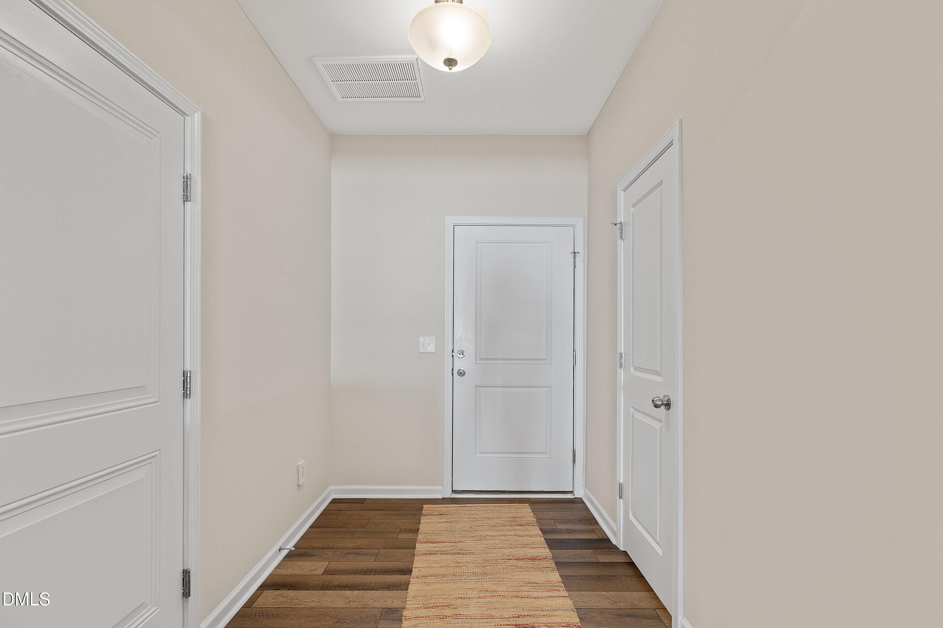 1004 Everglades Way Durham, NC 27713 - Photo 6 of 40 a view of a hallway with wooden floor
