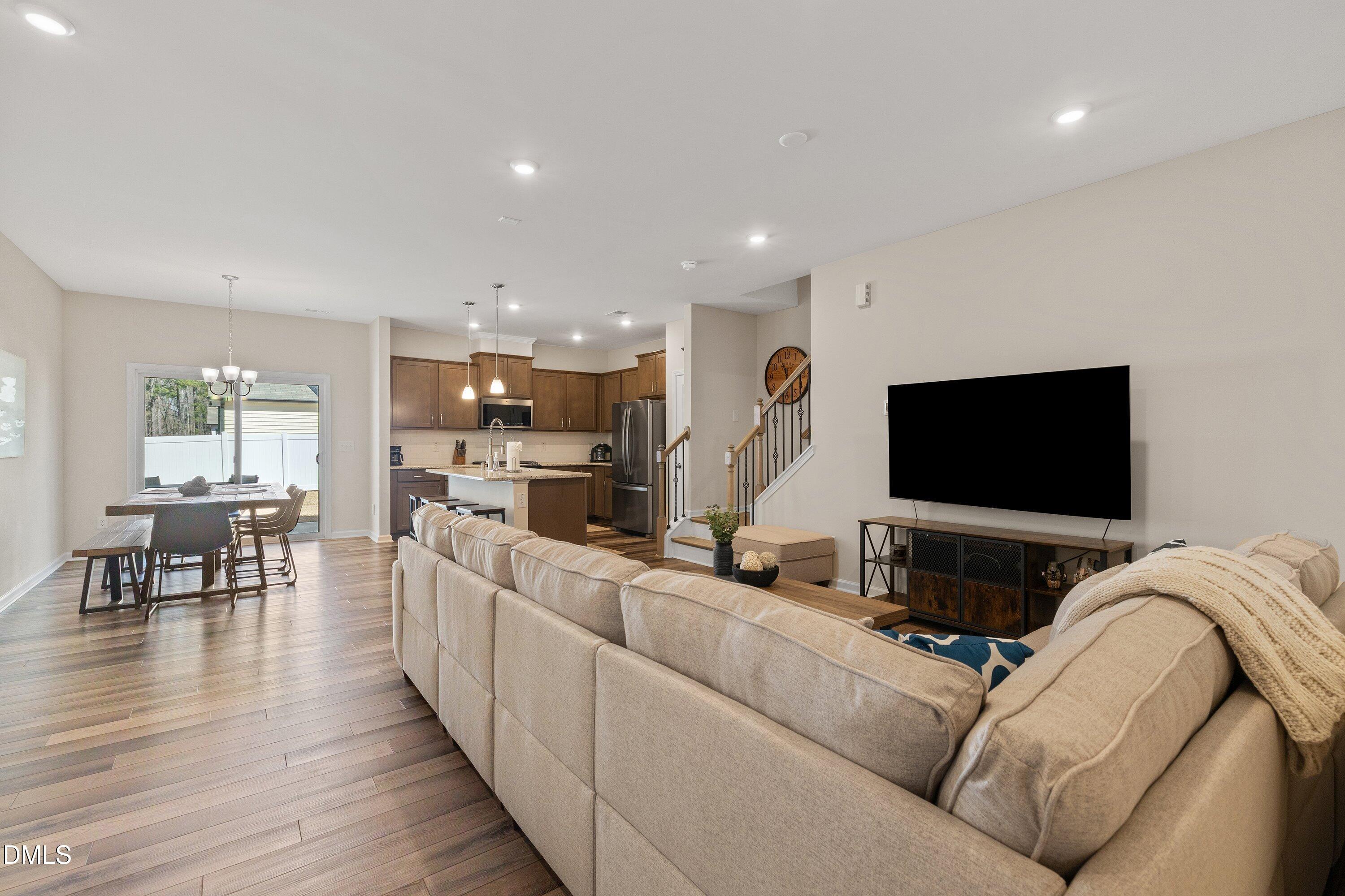 1004 Everglades Way Durham, NC 27713 - Photo 7 of 40 a living room with furniture and a flat screen tv