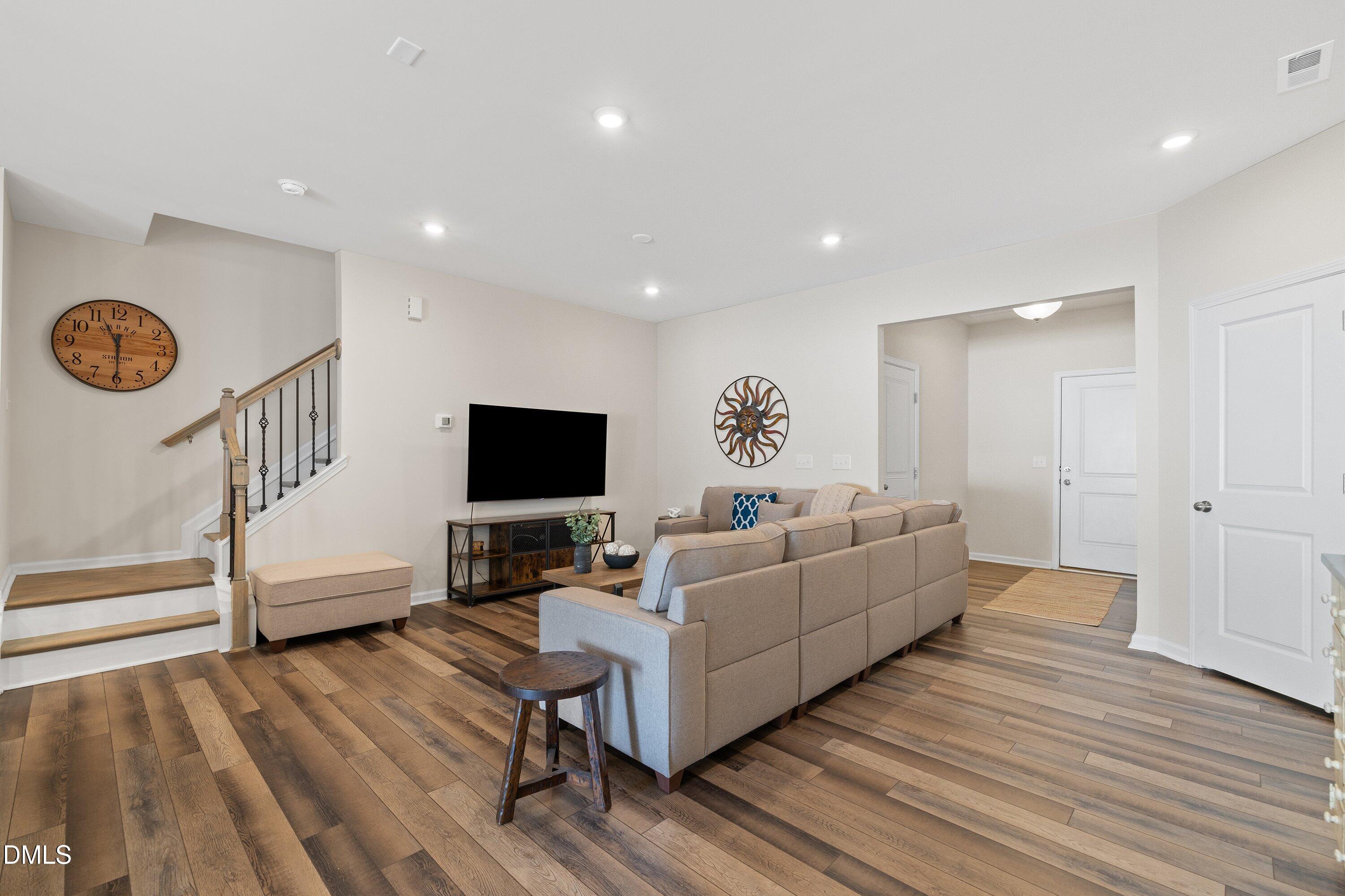 1004 Everglades Way Durham, NC 27713 - Photo 9 of 40 a living room with furniture and a flat screen tv