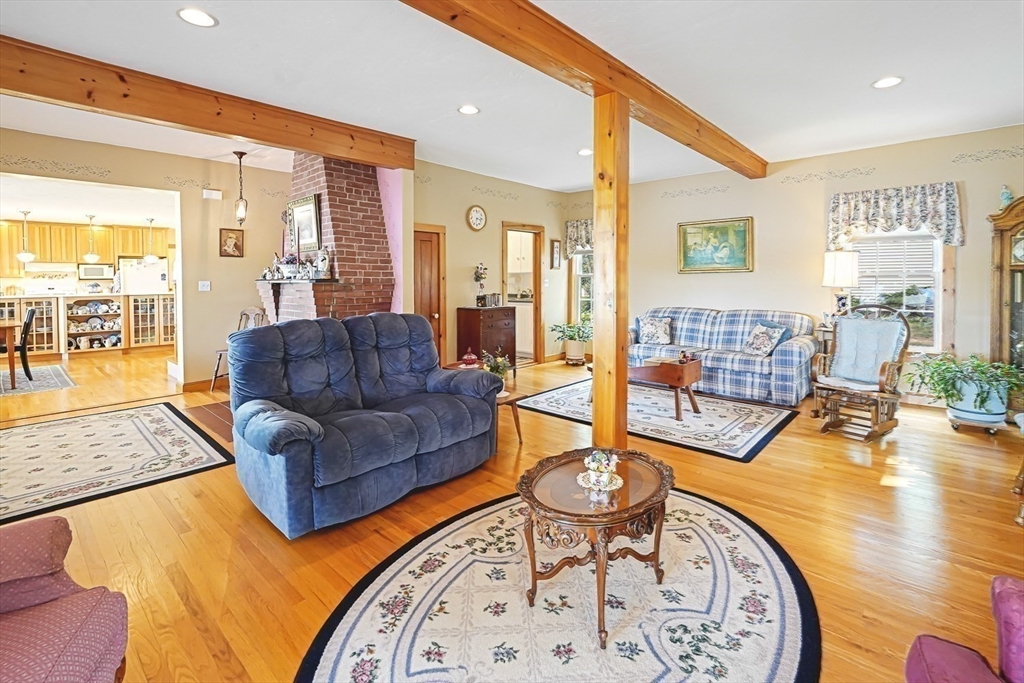31 Bay View Road Webster, MA 01570 - Photo 18 of 42 a living room with furniture and a table