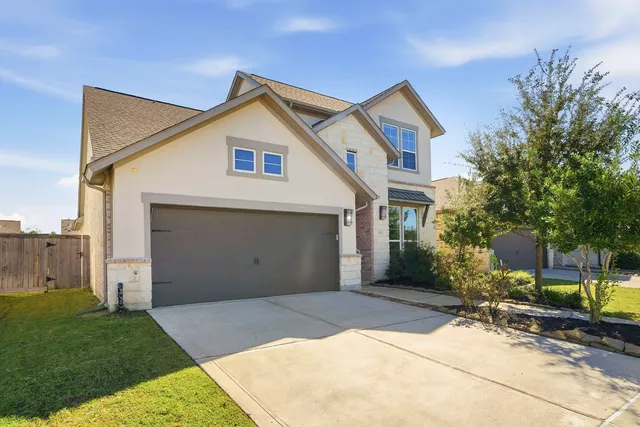 a view of backyard of house and outdoor seating