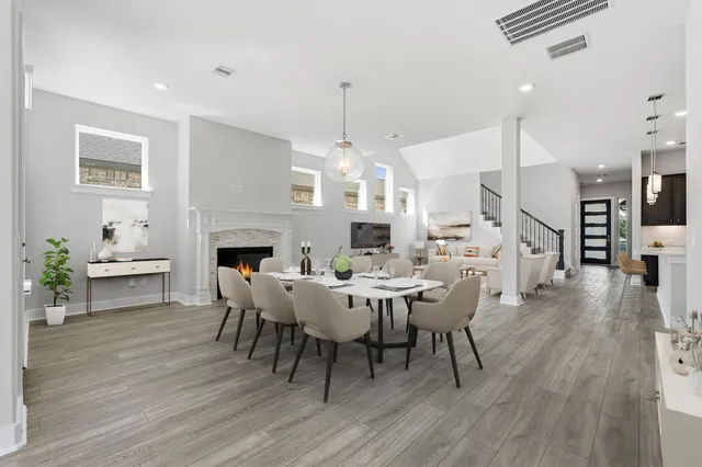 a spacious bathroom with a double vanity sink mirror and toilet
