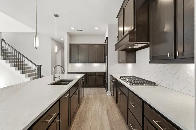 a view of a backyard with a garden and entertaining space