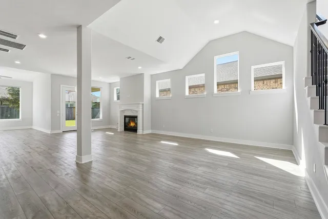 a living room with furniture kitchen view and a table