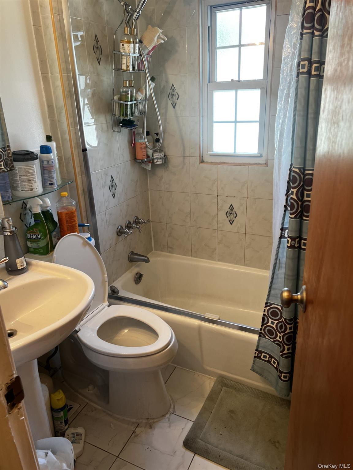 349 County Center Road, Unit TOP White Plains, NY 10603 - Photo 17 of 17 a bathroom with a sink a toilet and shower