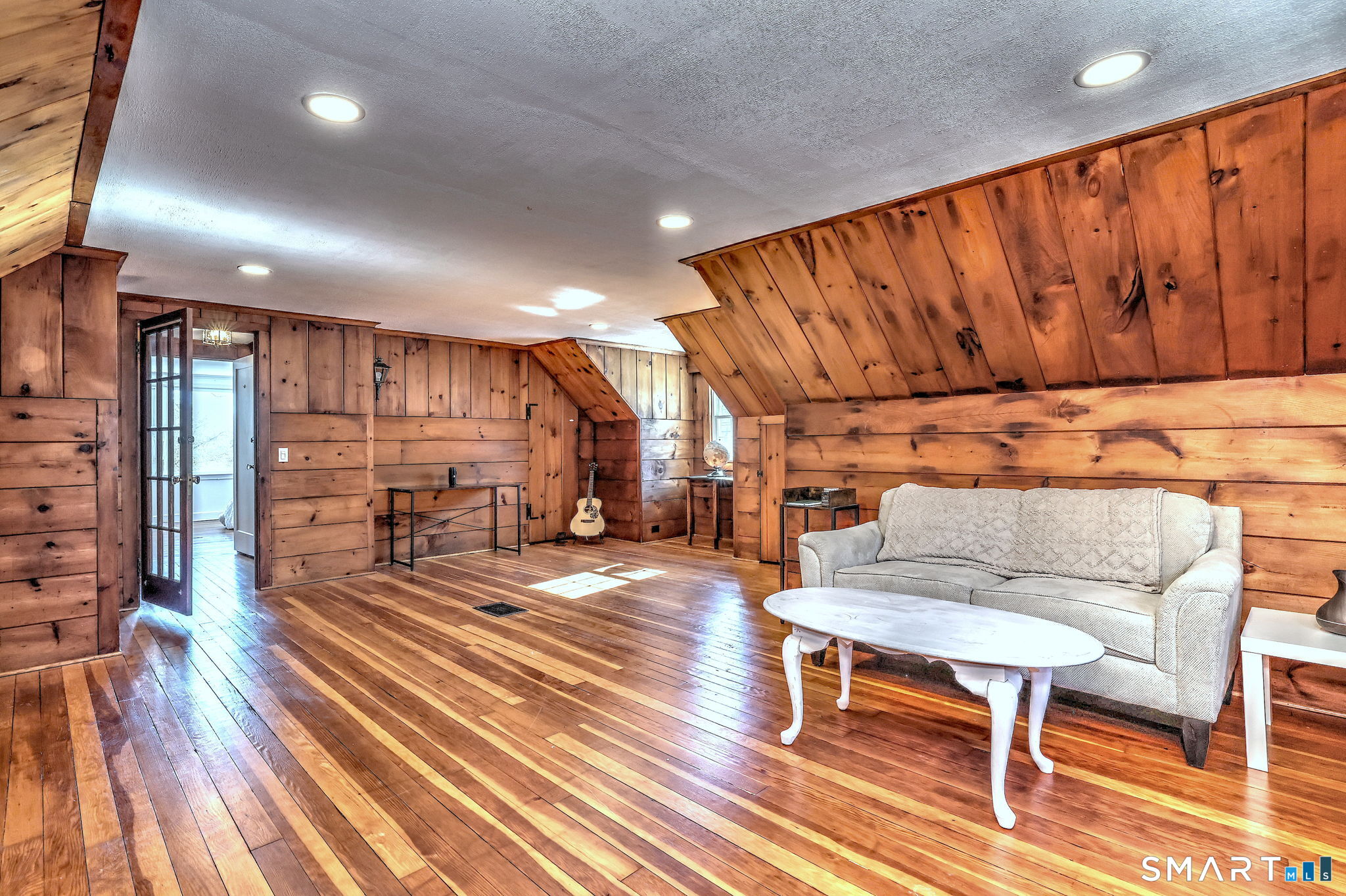 3 Wheeler Drive Trumbull, CT 06611 - Photo 16 of 32 a living room with furniture a wooden floor and next to a window