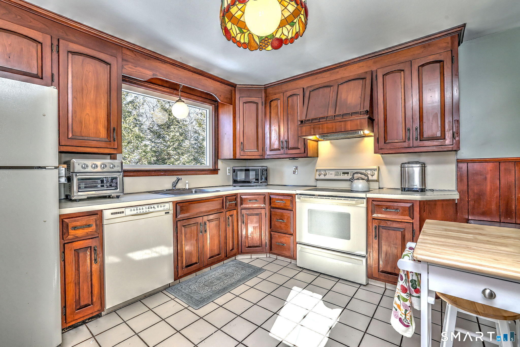 3 Wheeler Drive Trumbull, CT 06611 - Photo 25 of 32 a kitchen with stainless steel appliances granite countertop a stove sink and cabinets