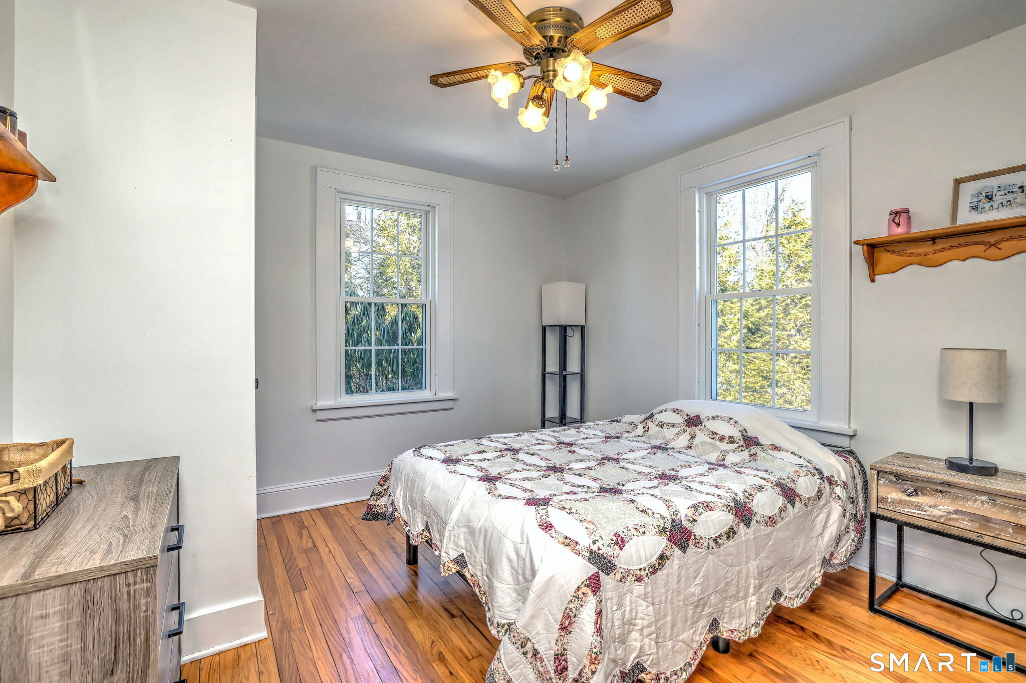 3 Wheeler Drive Trumbull, CT 06611 - Photo 7 of 32 a bedroom with a bed and a chandelier