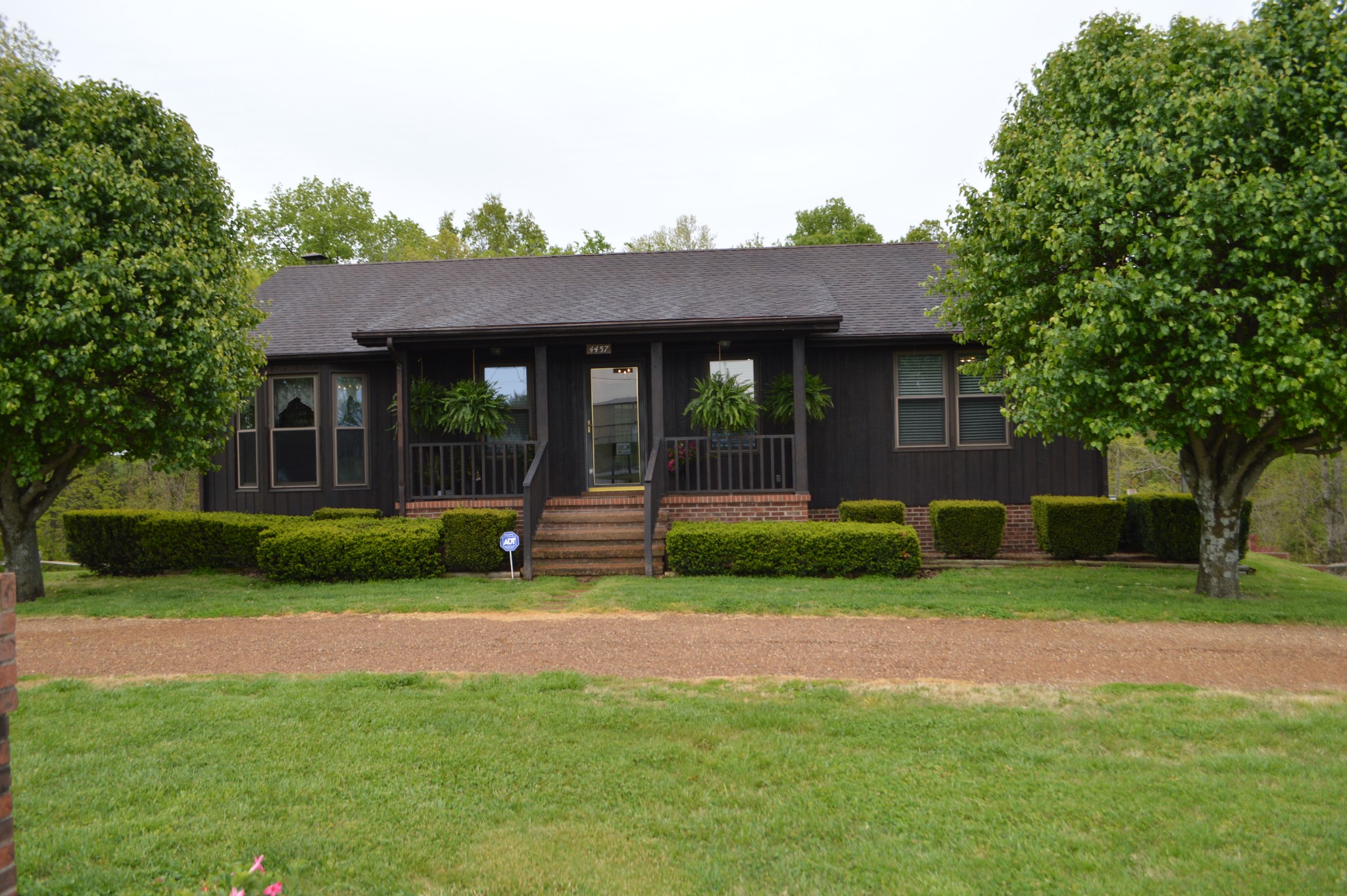 4457 Airport Road Springfield, TN 37172 - Photo 1 of 6 a front view of a house with a garden