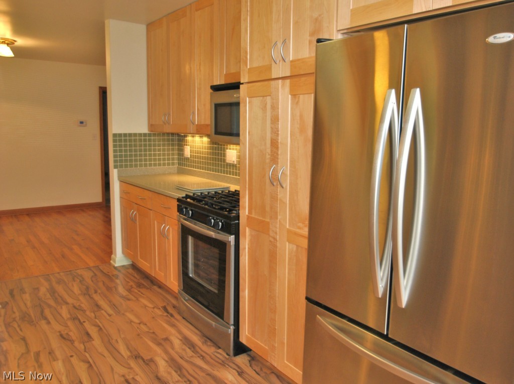3271 Edington Road Akron, OH 44333 - Photo 7 of 20 Kitchen includes the stainless steel French door style refrigerator/freezer, gas range, microwave & dishwasher.