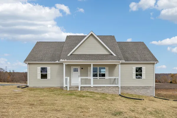 a house with trees in the background