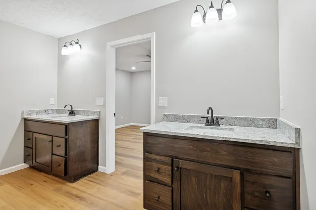 a bathroom with a sink double vanity and a mirror
