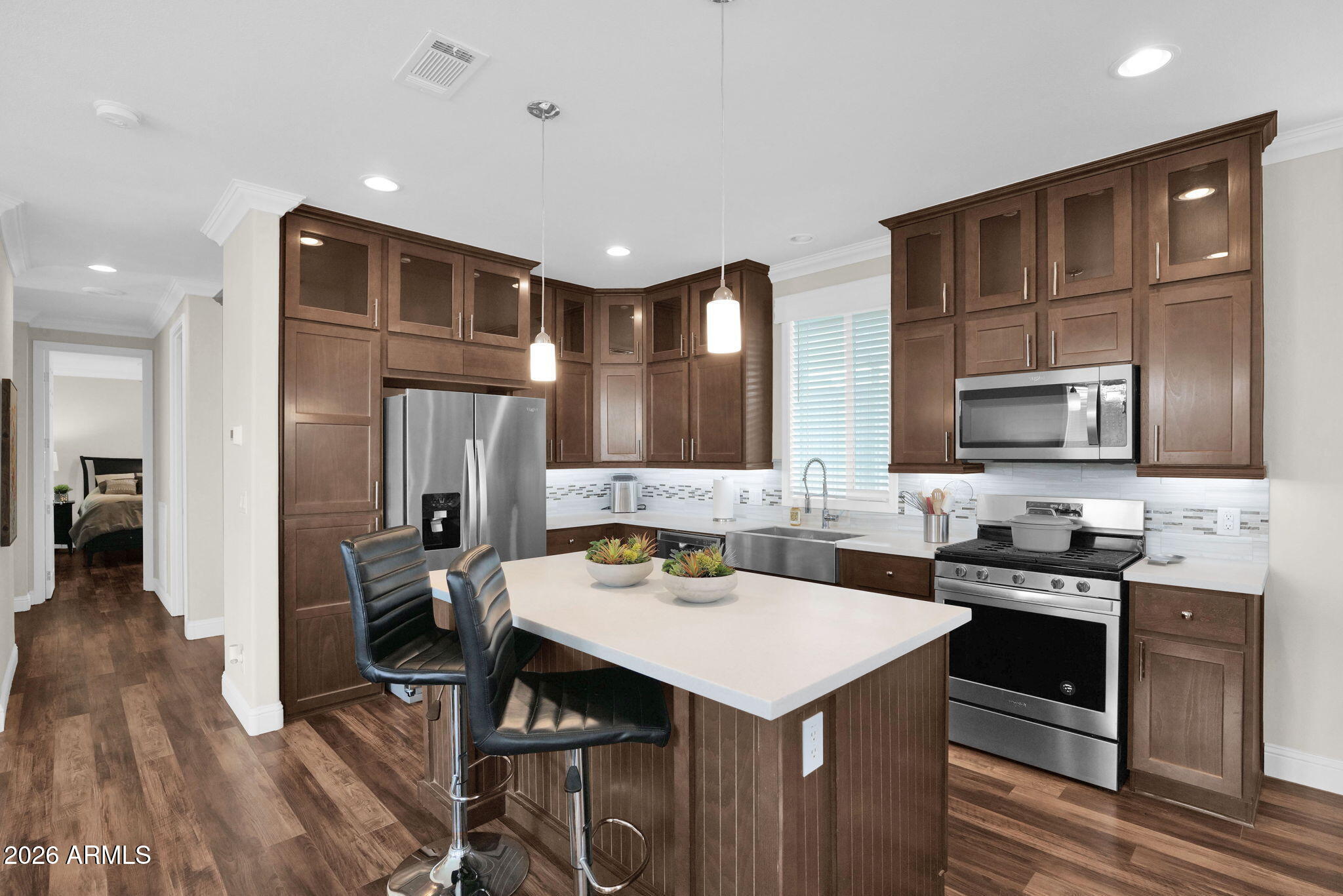 3300 East Broadway Road, Unit 252 Mesa, AZ 85204 - Photo 11 of 35 a kitchen with sink refrigerator and cabinets