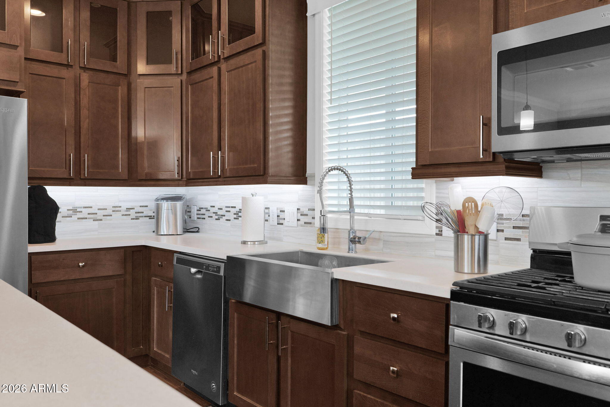 3300 East Broadway Road, Unit 252 Mesa, AZ 85204 - Photo 15 of 35 a kitchen with a sink stove and cabinets