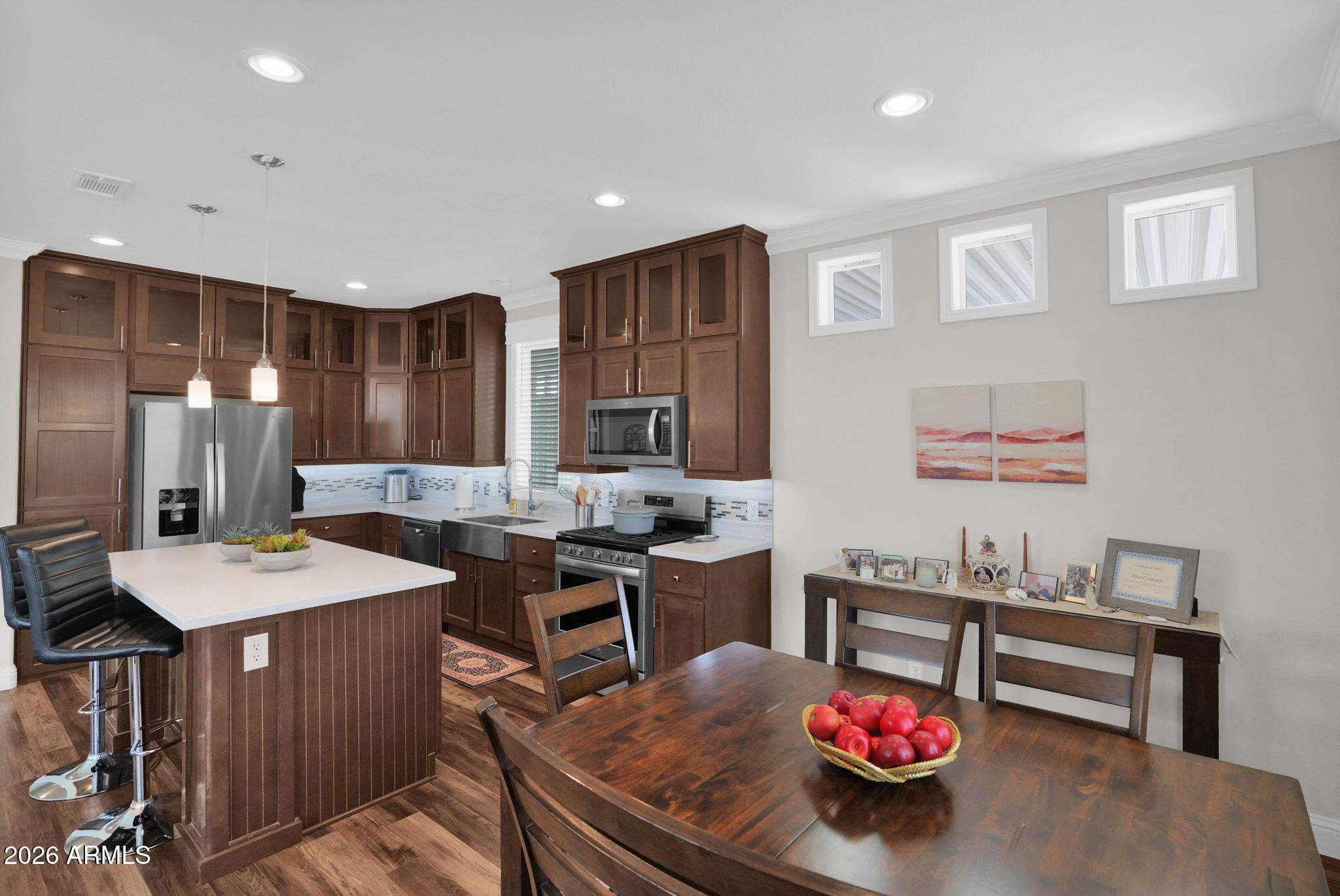 3300 East Broadway Road, Unit 252 Mesa, AZ 85204 - Photo 19 of 35 a kitchen with a table chairs stove and refrigerator