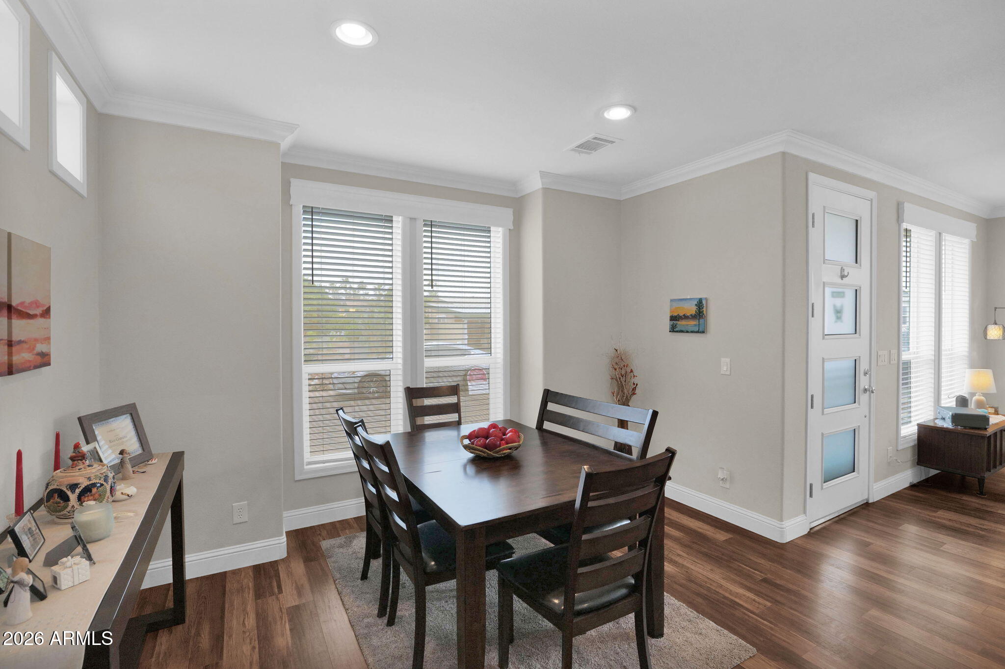 3300 East Broadway Road, Unit 252 Mesa, AZ 85204 - Photo 21 of 35 a view of a dining room with furniture window and wooden floor
